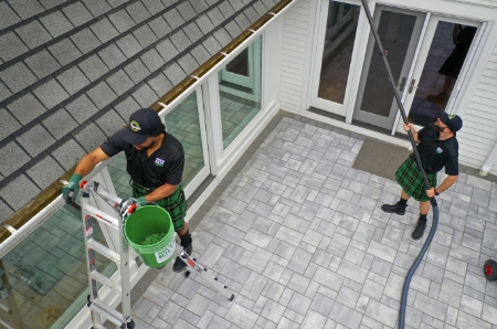 Two Men In Kilts technicians using different top-of-the-line tools to clean residential gutters.