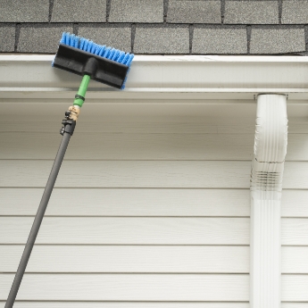 Long extension brush cleaning gutter.